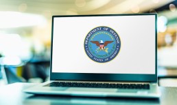 Department of Defense logo on laptop screen